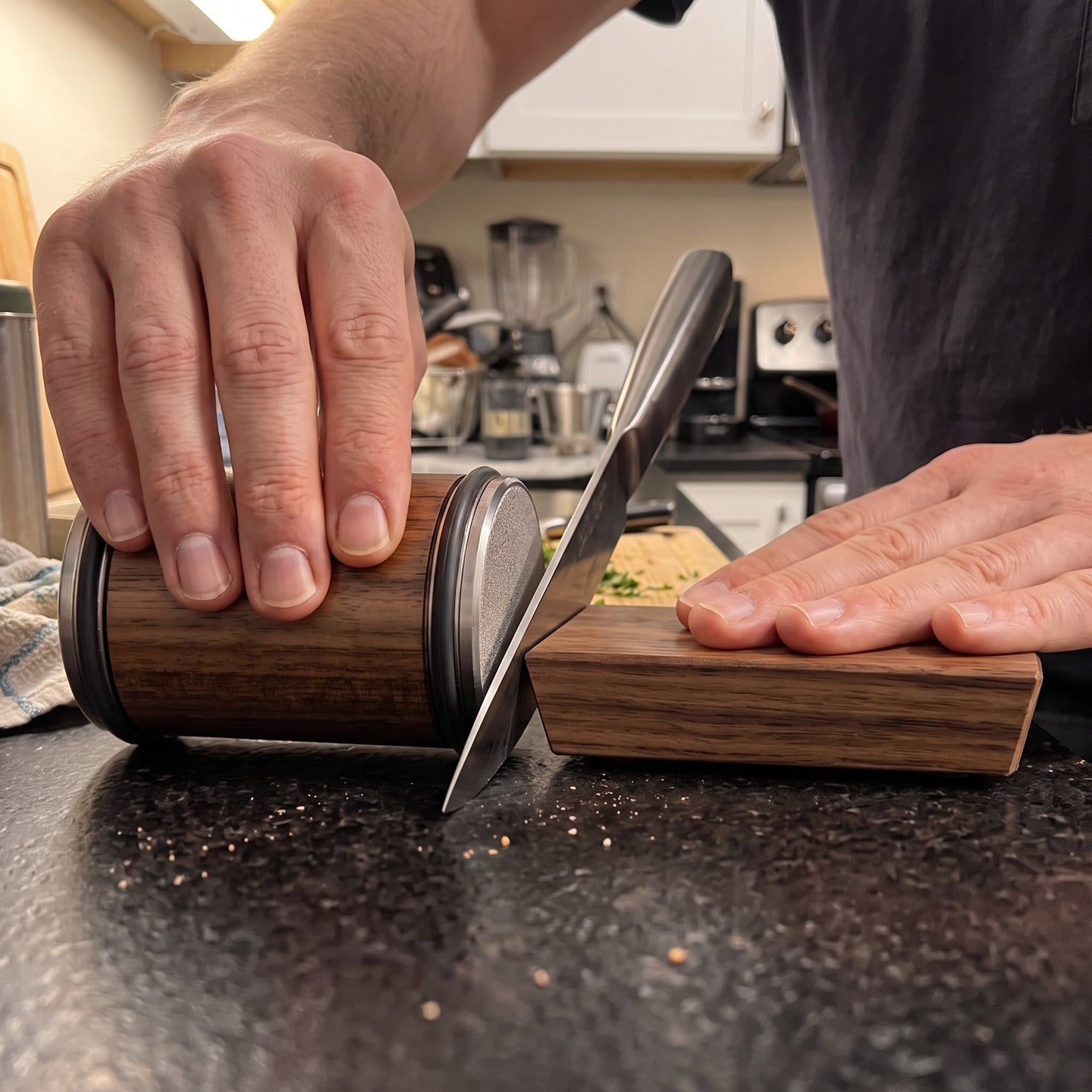 A different close angle of the roller beside a guided kitchen knife